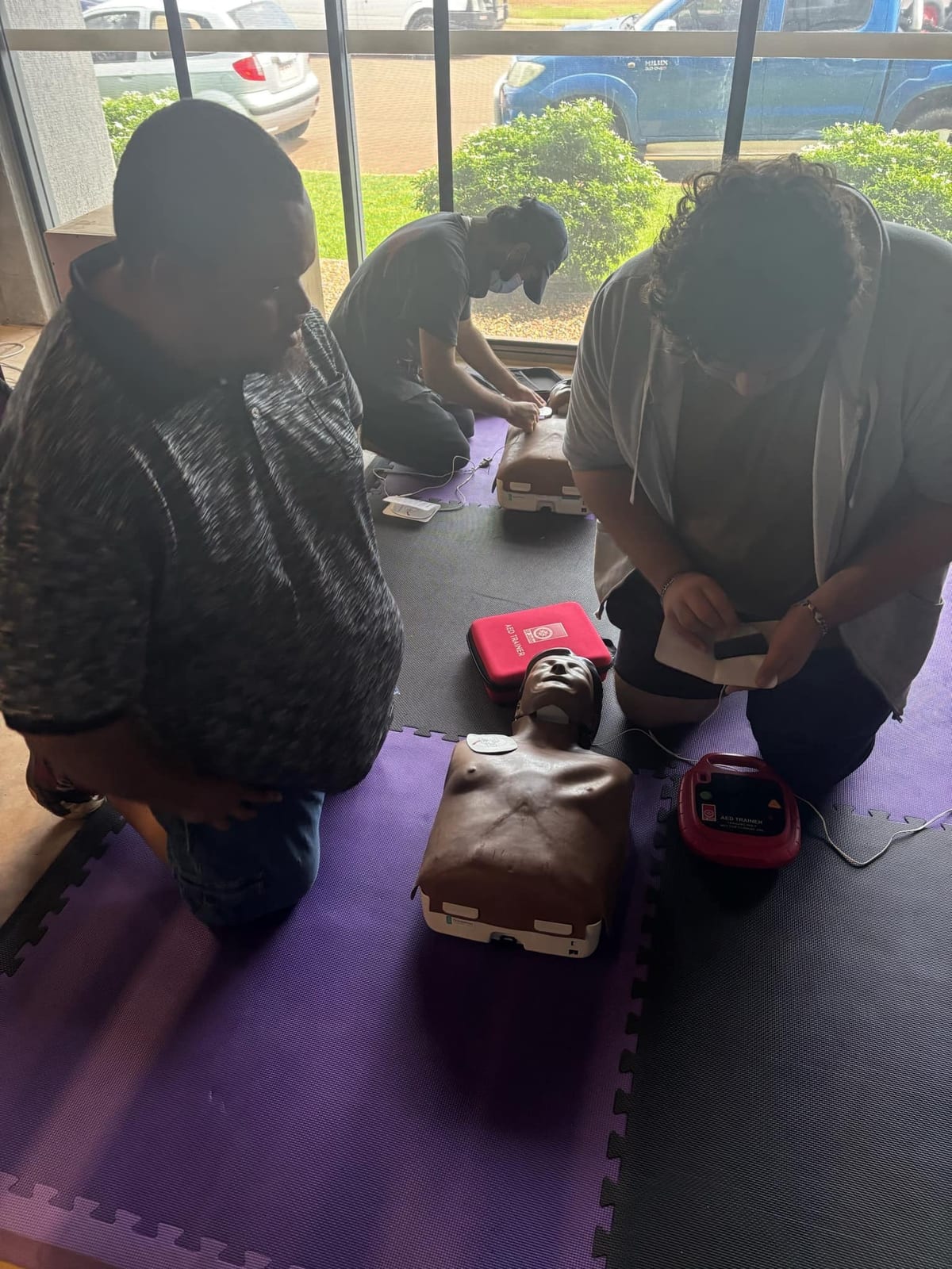 Group of participants taking part in a hands-on first aid training session